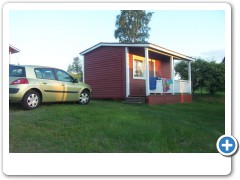 Little red hut at midnight in Finland