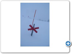 A 2 metre high marker in deep snow